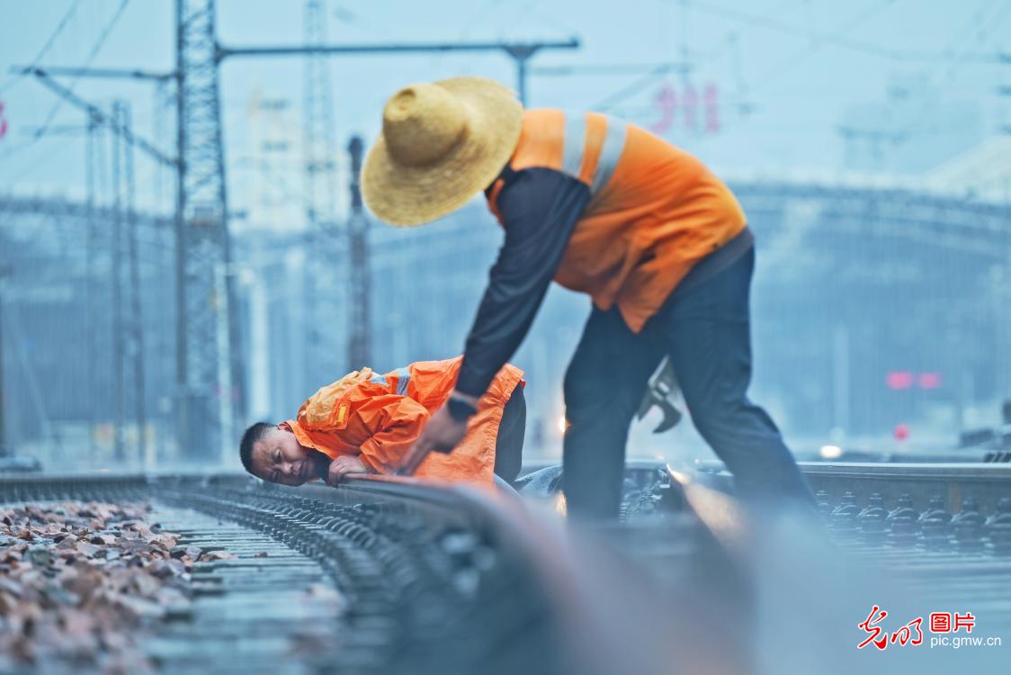 Track maintenance work carried out before rain storm in C China's Zhengzhou