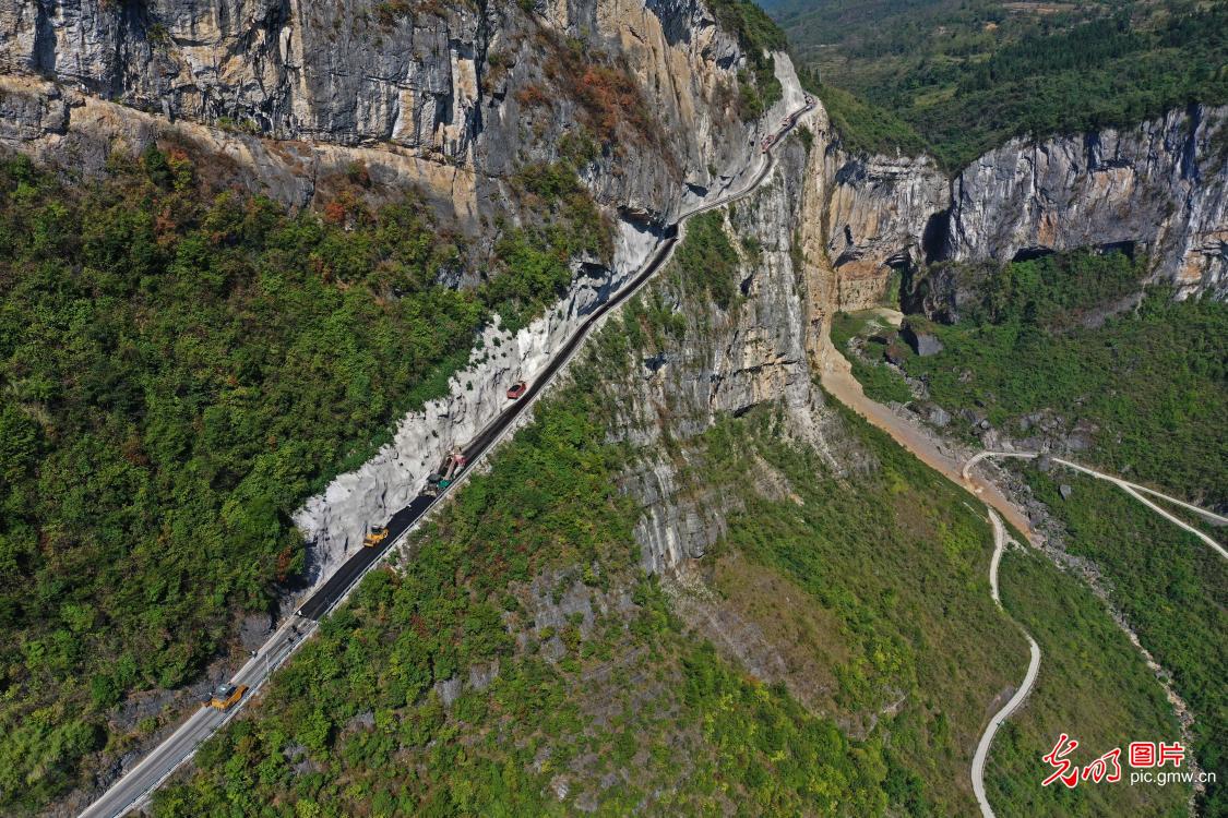 Cliff road under construction in SW China's Chongqing