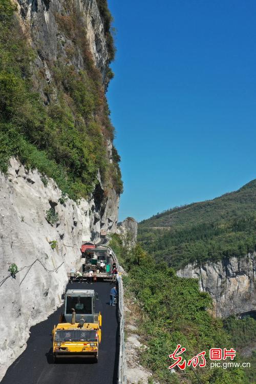 Cliff road under construction in SW China's Chongqing