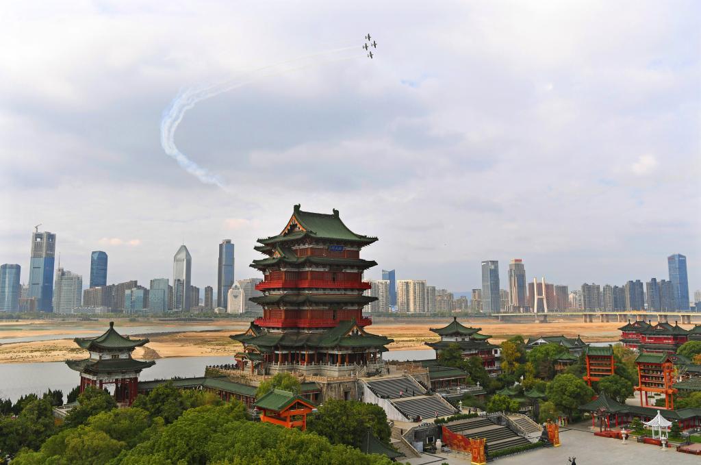 Aircrafts from South African aerobatics team perform above downtown Nanchang in E China
