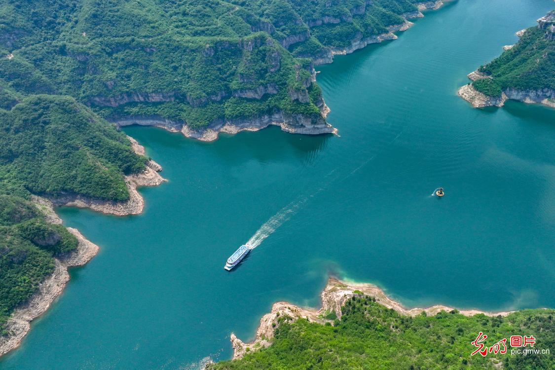 Tourist boat traverse picturesque Three Gorges in C China's Henan