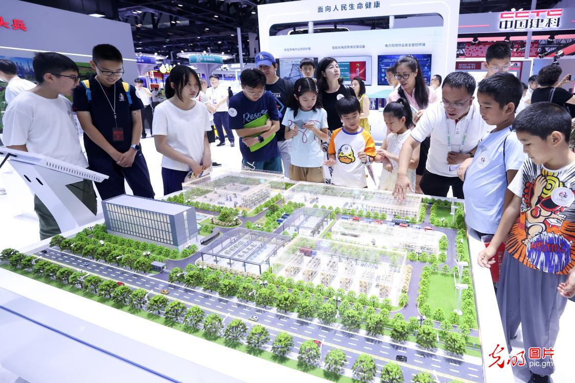 Visitors enjoy innovations at the 26th China Beijing International High-tech Expo