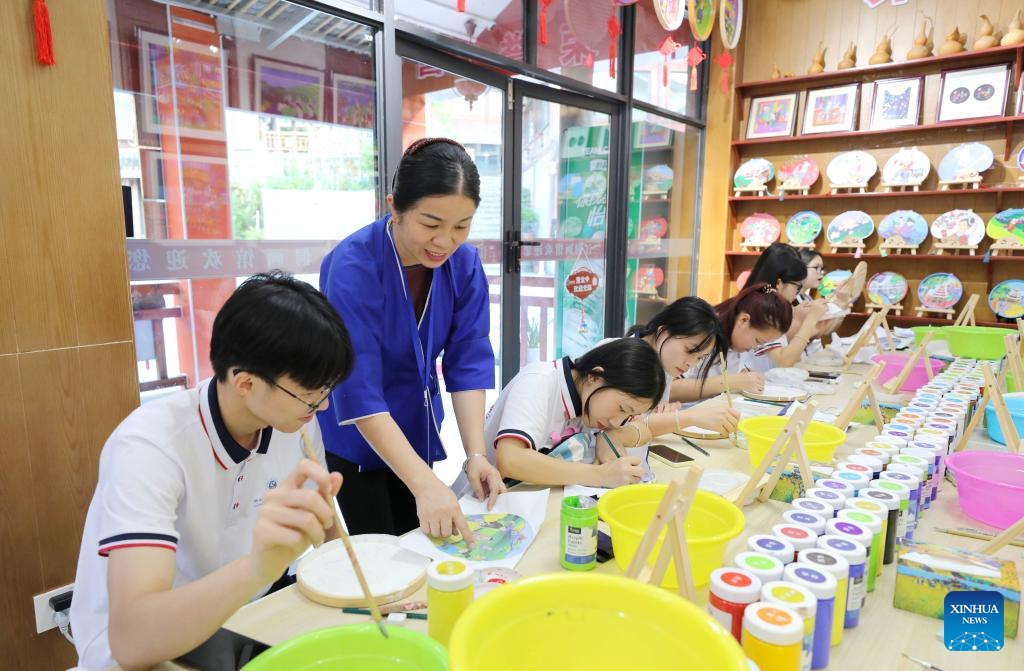 In pics: Sanjiang farmer painting in S China's Guangxi