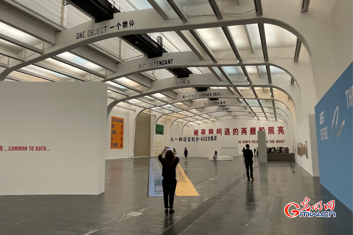 People visiting exhibition themed with pursuit of happiness on Chinese Valentine's Day