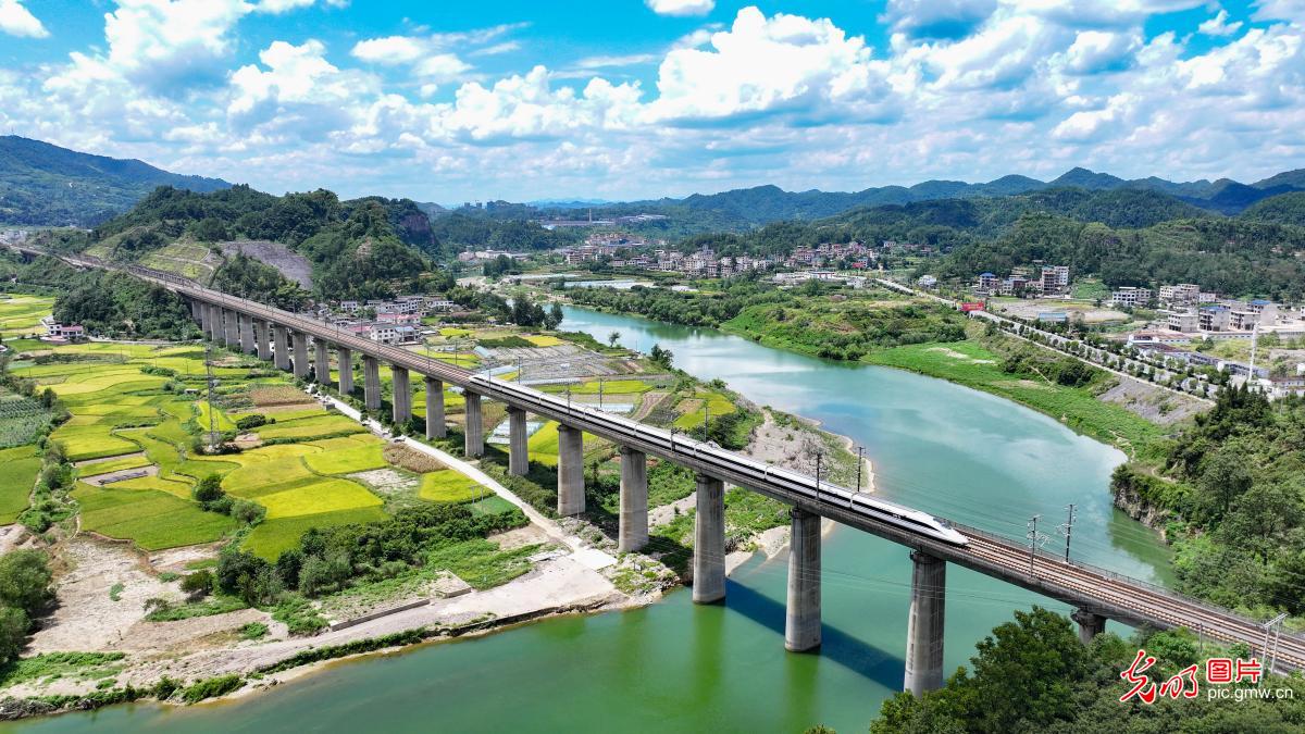 Yuping Dong Autonomous County of SW China’s Guizhou: a train passing through early autumn