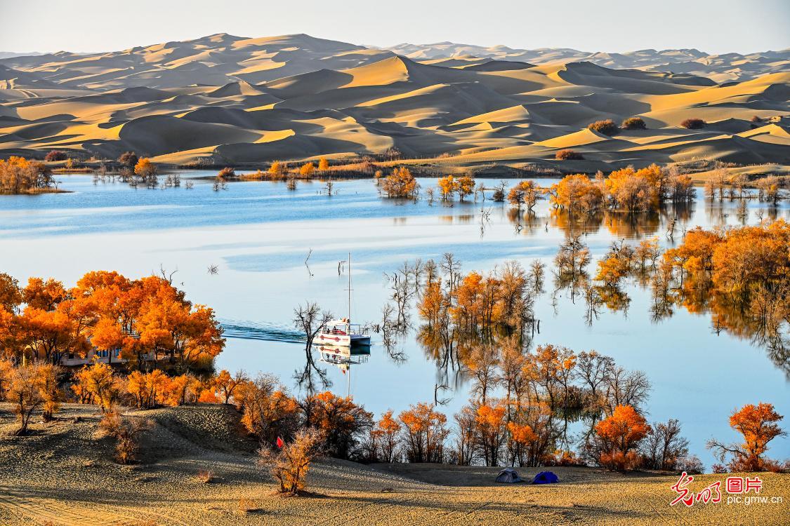 Beautiful scenery of sand mountain and clear water in NW China’s Xinjiang