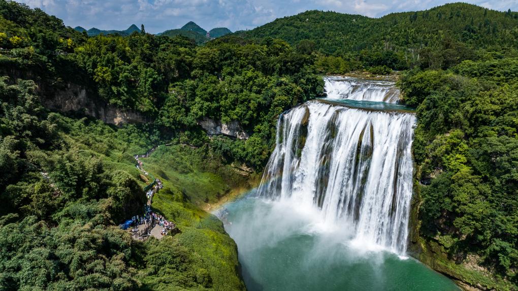 Tourists visit Huangguoshu waterfall scenic area in Anshun, SW China