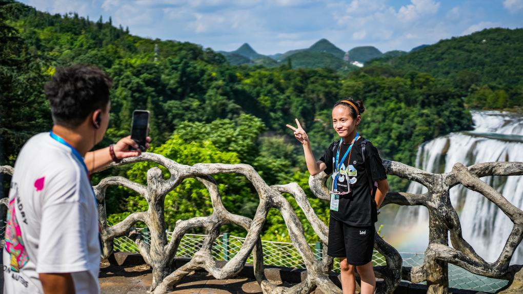 Tourists visit Huangguoshu waterfall scenic area in Anshun, SW China