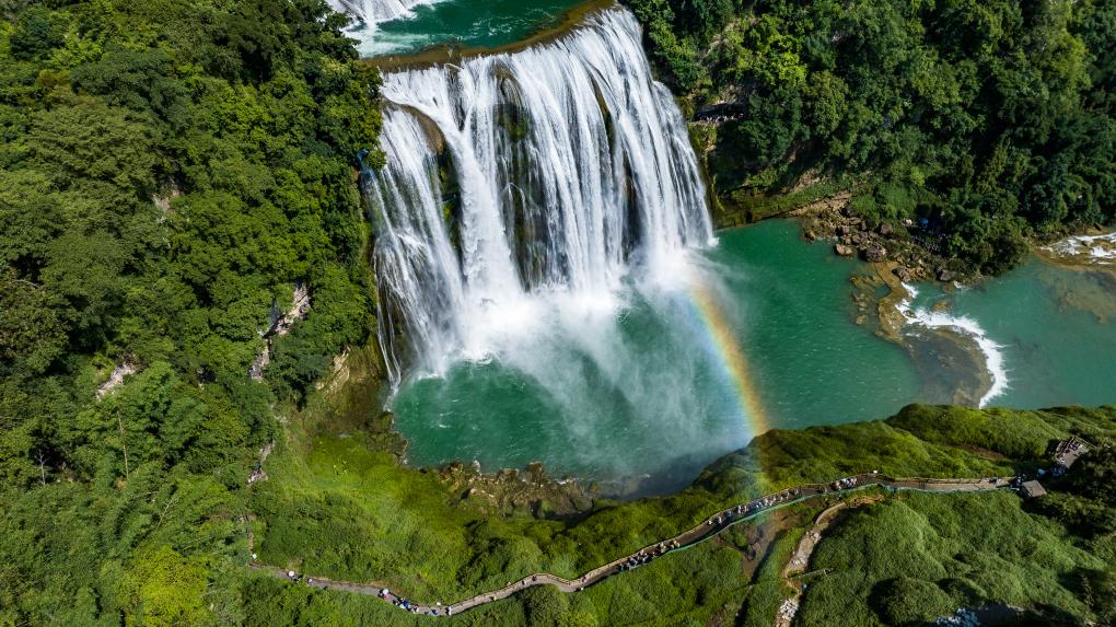 Tourists visit Huangguoshu waterfall scenic area in Anshun, SW China
