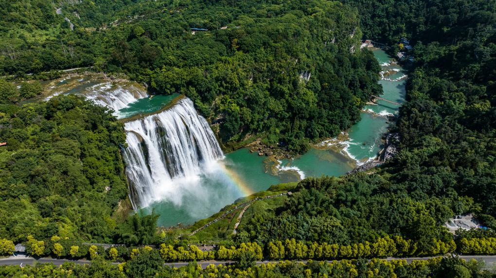 Tourists visit Huangguoshu waterfall scenic area in Anshun, SW China