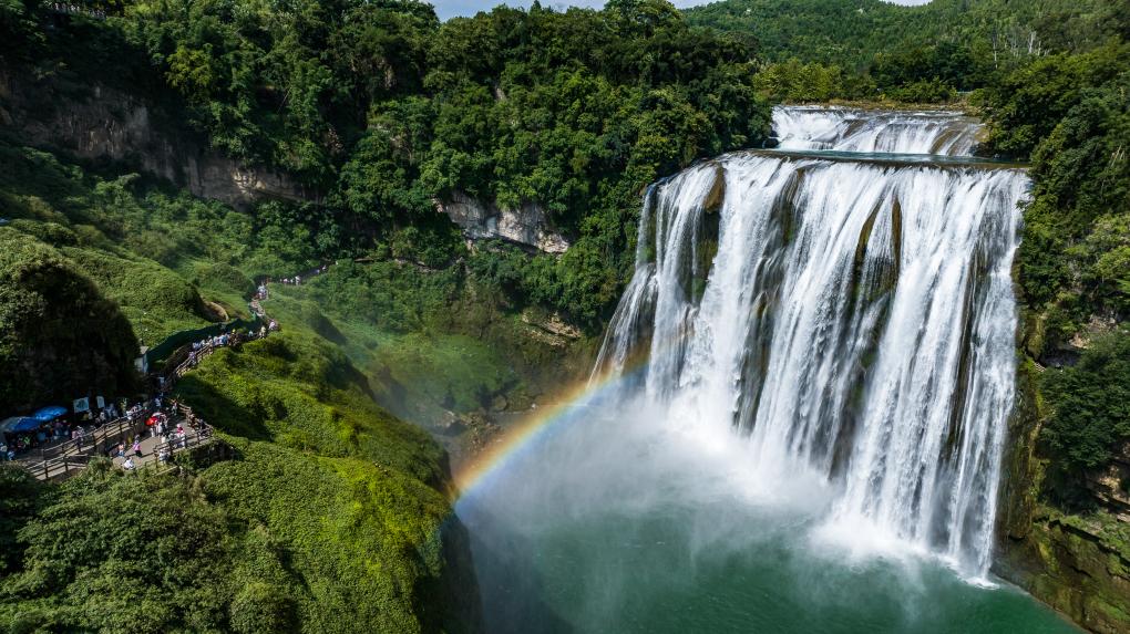 Tourists visit Huangguoshu waterfall scenic area in Anshun, SW China