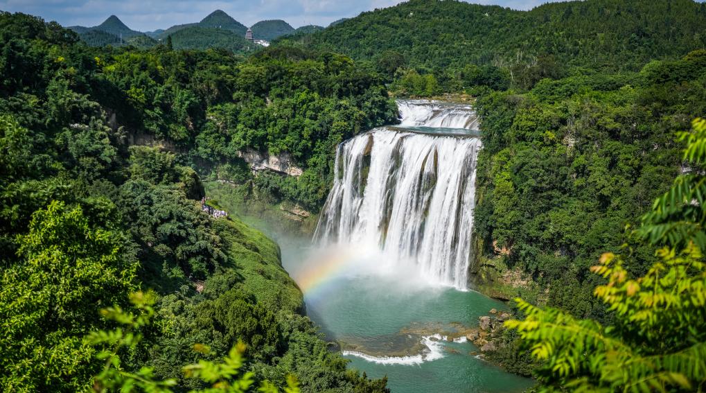 Tourists visit Huangguoshu waterfall scenic area in Anshun, SW China