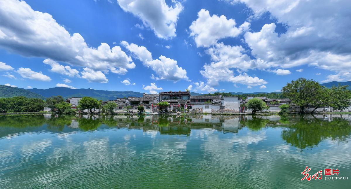 Picturesque reflections merge sky and water at Hongcun Village in E China's Anhui