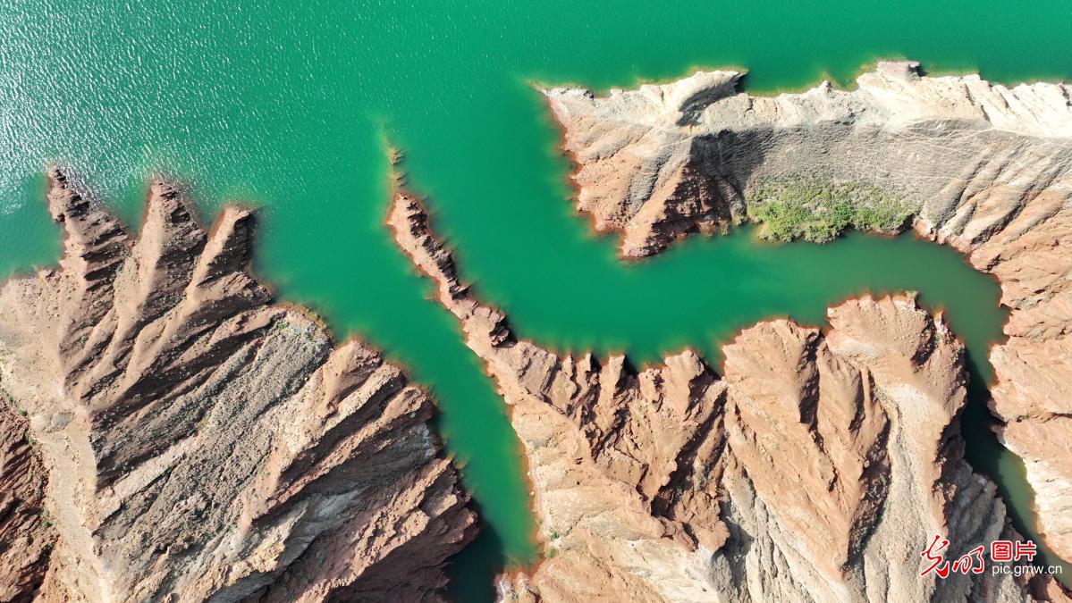 Danxia landform reflections paint stunning scene in NW China's Gansu