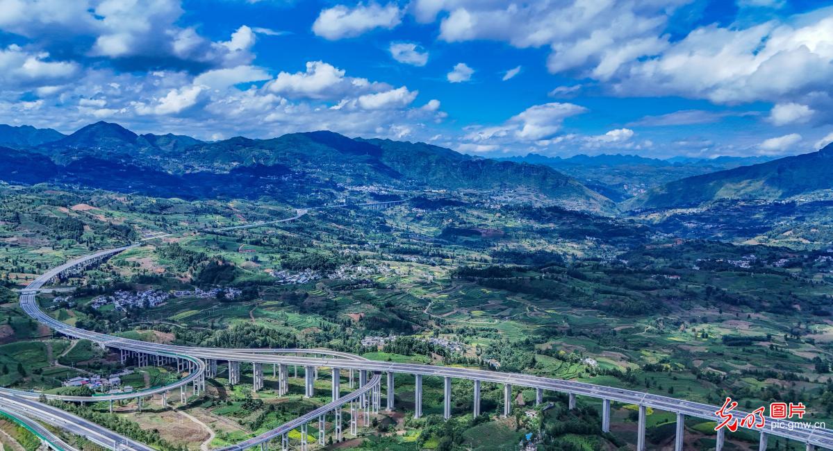 Expressway weaves through tea mountains and villages in SW China's Guizhou