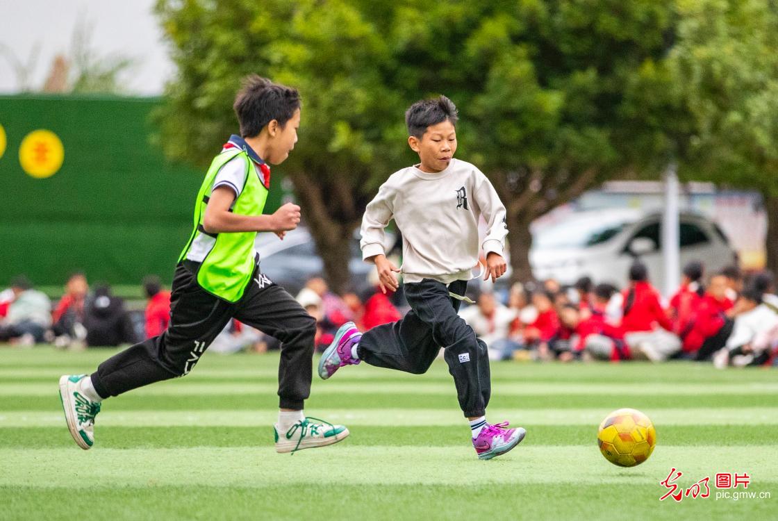 Young players practice football in SW China's Guizhou