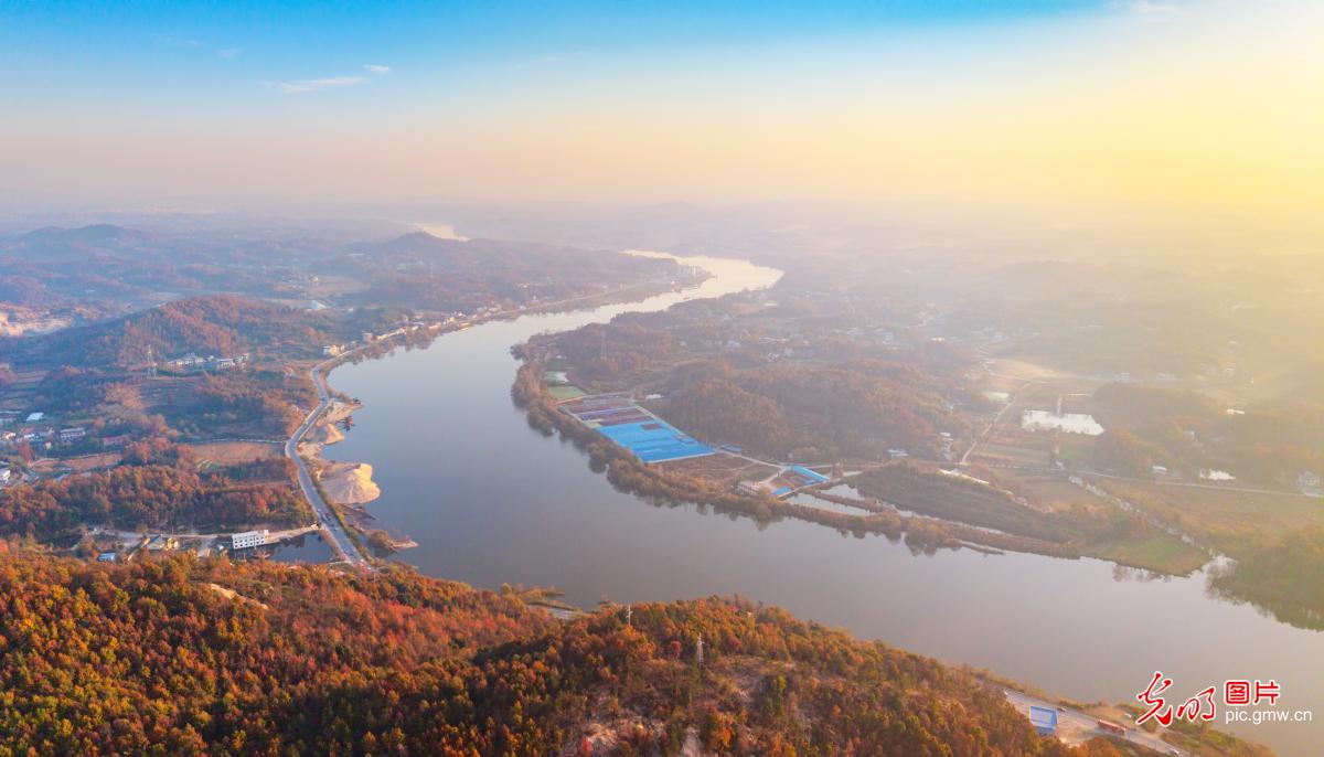 Sunlit river banks in C China's Hubei