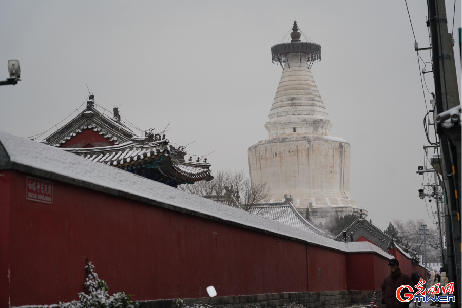 First snowfall of this winter season at centuries-old Miaoying Temple in downtown Beijing
