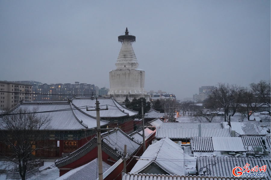 First snowfall of this winter season at centuries-old Miaoying Temple in downtown Beijing