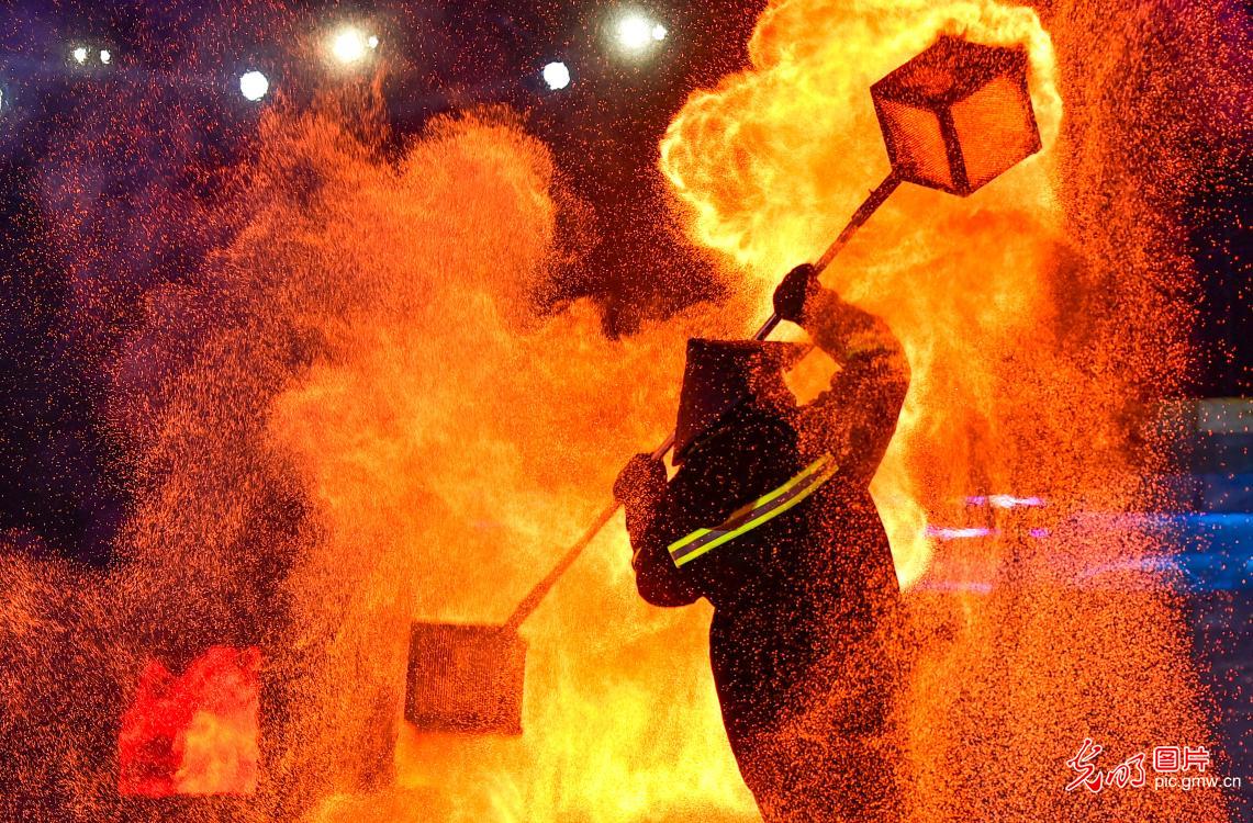 Molten iron sparks light up ice and snow festival in Inner Mongolia