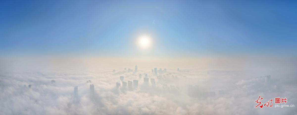 Morning mist drapes urban skyline in E China's Jiangsu