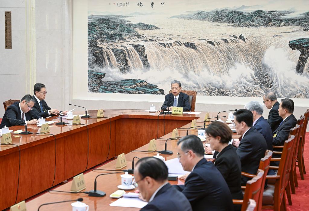 Chinese legislators hear reports amid legislative session