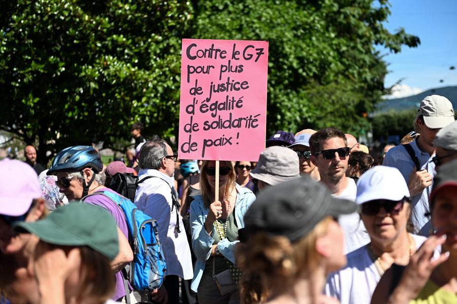 G7 summit kicks off against backdrop of massive protest