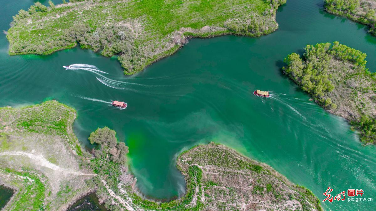 Boat tour on Kezijar Lake Scenic Area in NW China's Xinjiang Boat tour on Kezijar Lake Scenic Area in NW China's Xinjiang