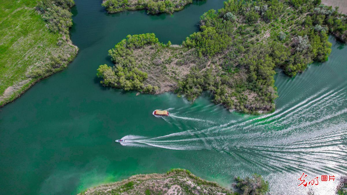 Boat tour on Kezijar Lake Scenic Area in NW China's Xinjiang Boat tour on Kezijar Lake Scenic Area in NW China's Xinjiang