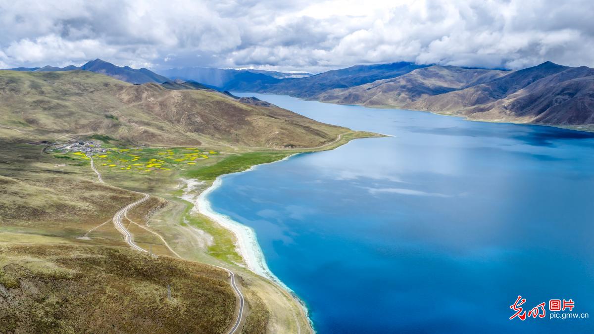 Serene beauty of Yamdrok Lake amid mountains Serene beauty of Yamdrok Lake amid mountains