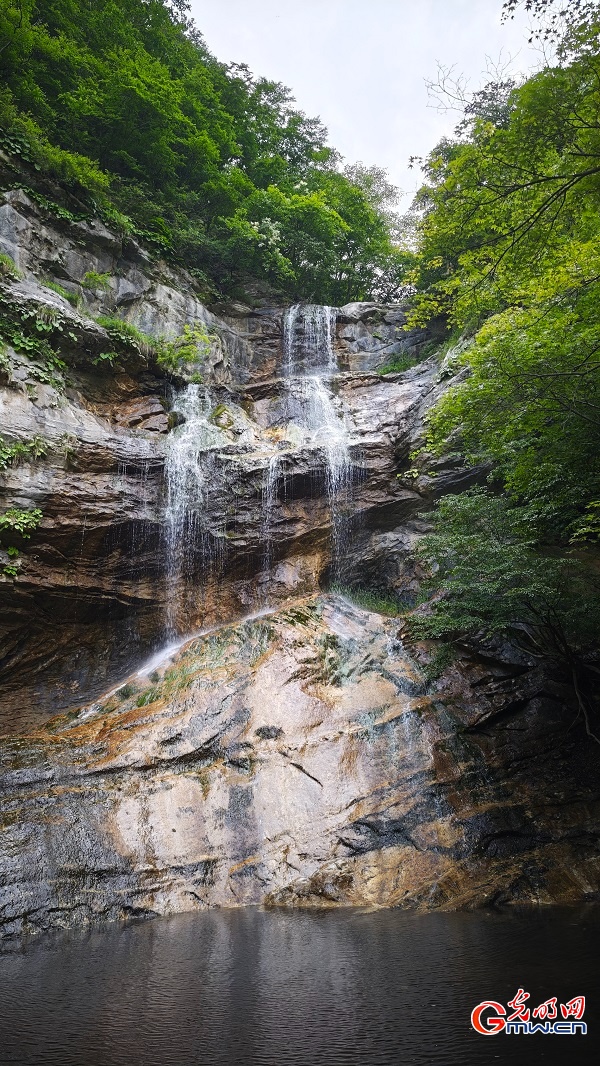 Photo taken on June 14, 2026 shows the early summer scenery of Lianquan Xianggu Valley in Huairou District, Beijing, China's capital city. The lush mountains, flowing streams and verdant landscape create a refreshing natural scene. (Wang Xinyuan/Guangming Picture)
