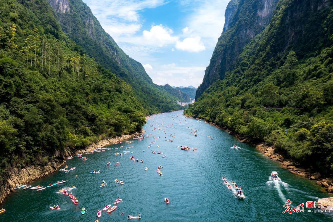 Paddleboarding on picturesque river in S China's Guangxi