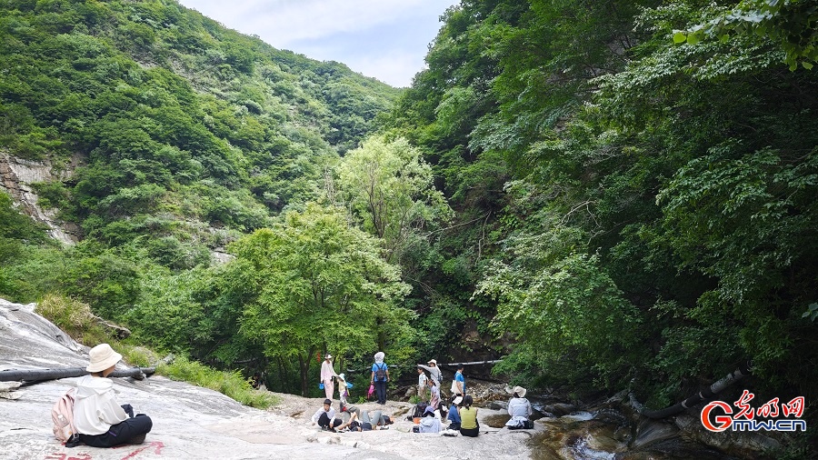 Photo taken on June 14, 2026 shows the early summer scenery of Lianquan Xianggu Valley in Huairou District, Beijing, China's capital city. The lush mountains, flowing streams and verdant landscape create a refreshing natural scene. (Wang Xinyuan/Guangming Picture)
