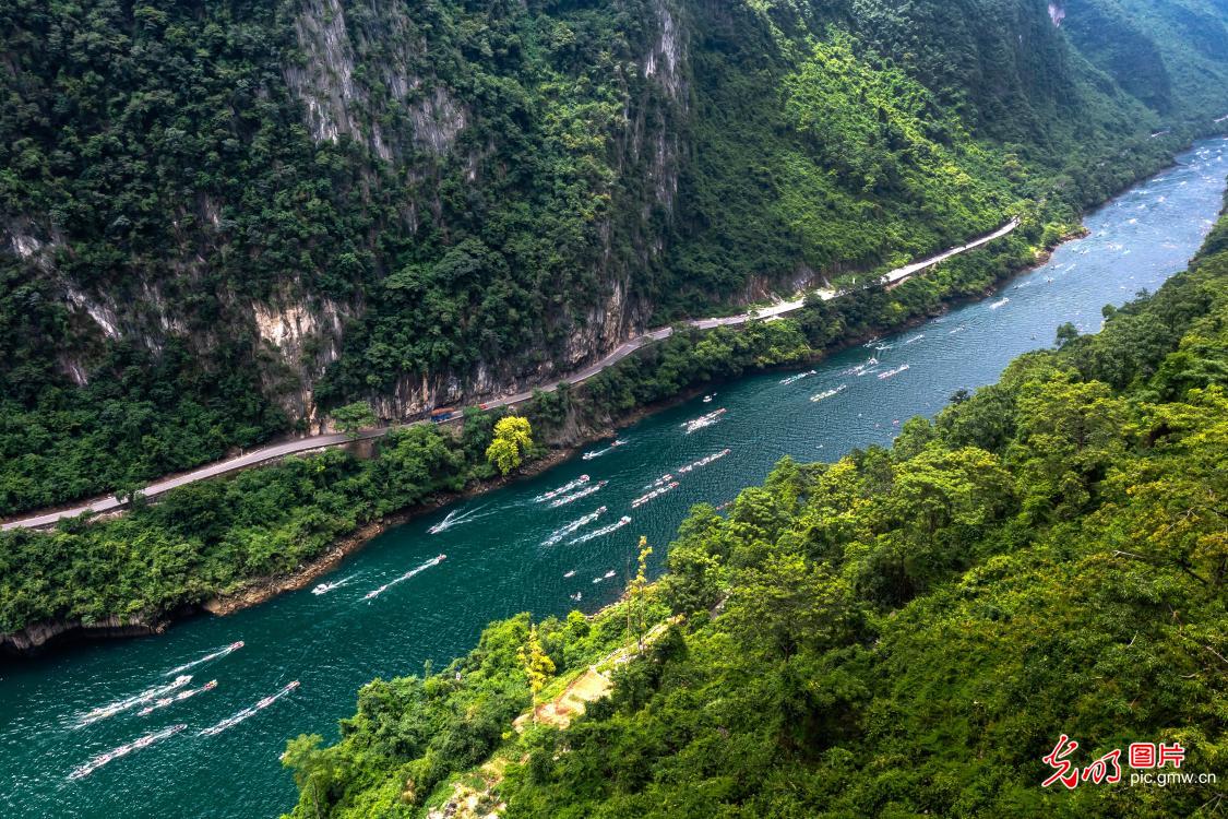 Paddleboarding on picturesque river in S China's Guangxi