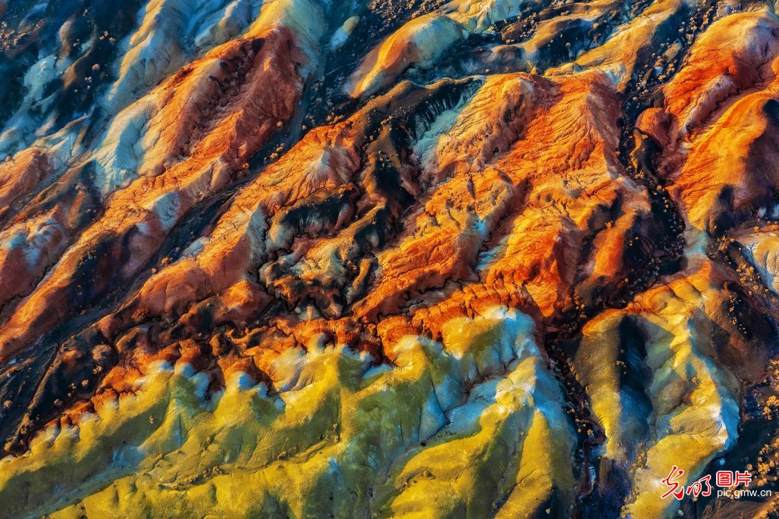 Sunset paints colorful Danxia landform in NW China's Xinjiang Sunset paints colorful Danxia landform in NW China's Xinjiang