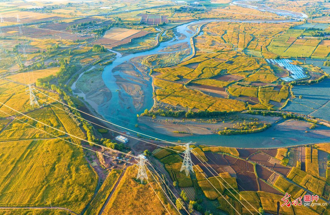 Winding river flows through picturesque countryside