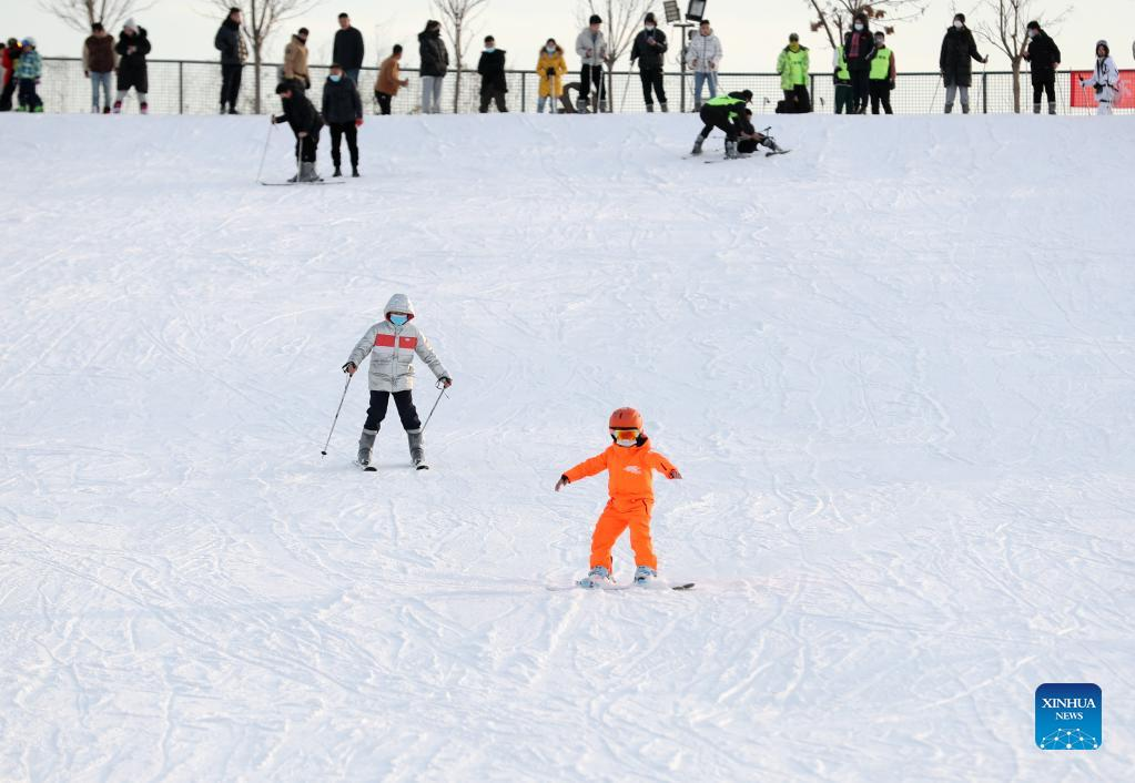 People enjoy winter activities across China