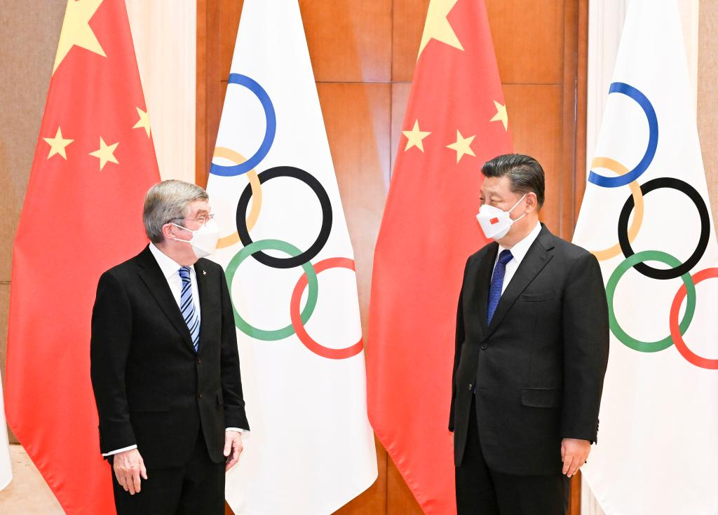 Meeting IOC chief, Xi says China ready to deliver simple, safe, splendid Winter Olympics
