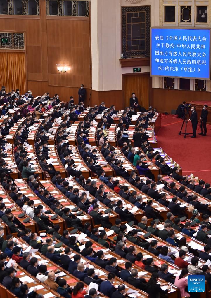 China's national legislature holds closing meeting of annual session