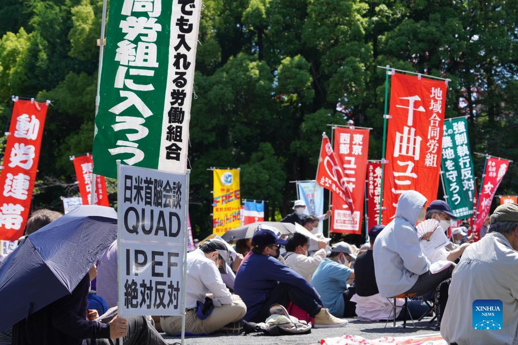 Biden starts Japan tour as protesters take to streets