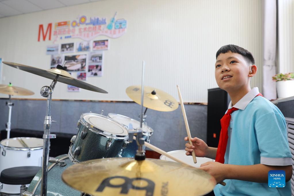 Students play musical instruments in Xinji Special Education School, N China's Hebei