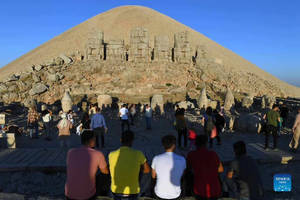 People visit tomb-sanctuary on Mount Nemrut in Adiyaman Province, Turkey