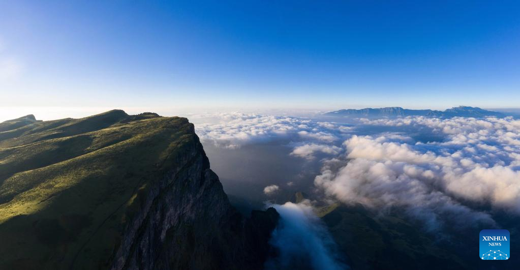 Scenery of Mount Longtou with clouds floating in SW China's Sichuan