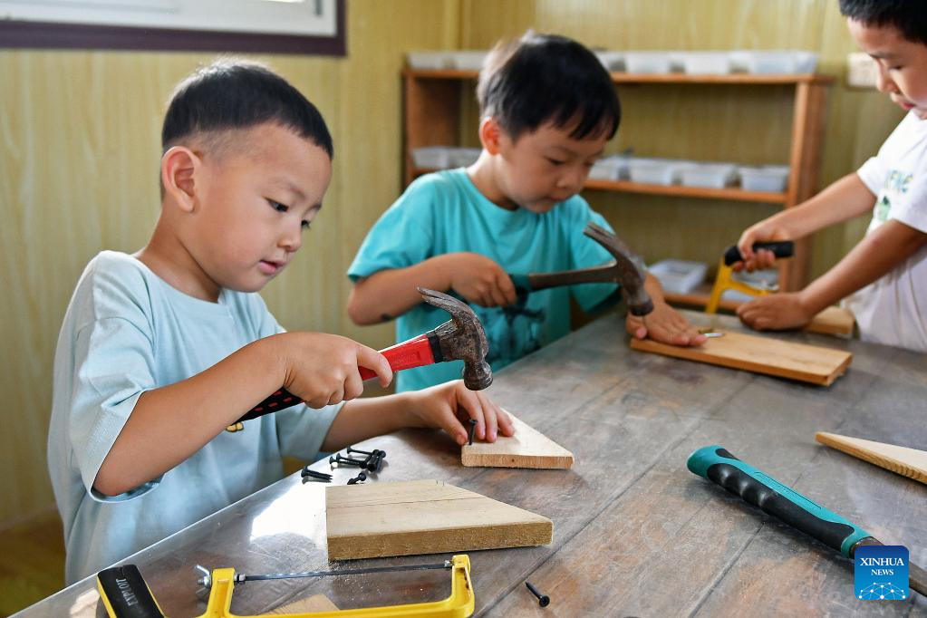 Children experience different activities during summer vacation across China