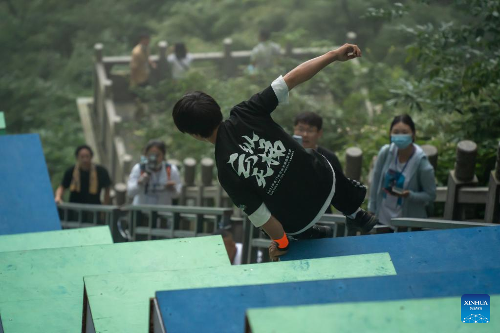 Parkour competitors descend thrilling course in China's famed Tianmen Mountain