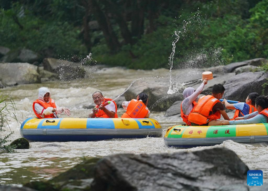 People enjoy drifting in Meiling scenic spot in E China