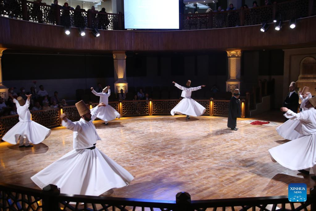 People perform Sufi whirling dance in Konya, Türkiye