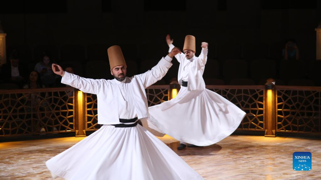 People perform Sufi whirling dance in Konya, Türkiye