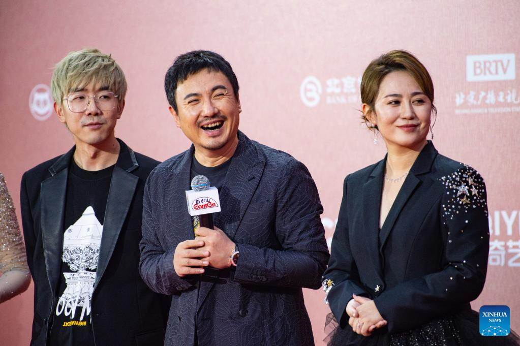 In pics: Stars sparkle on red carpet of 12th Beijing International Film Festival