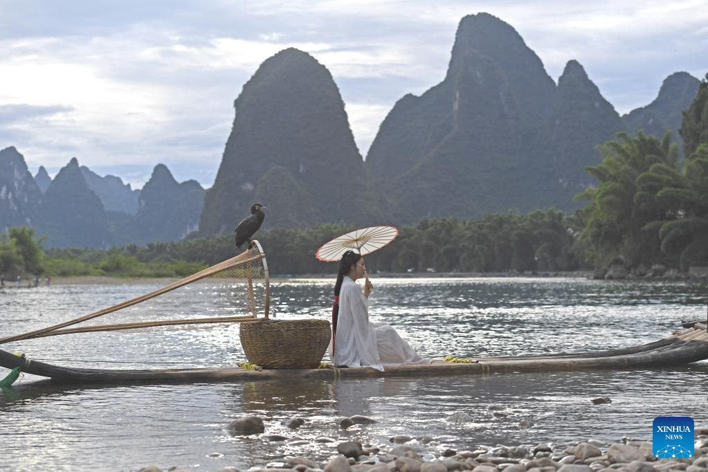 Villagers provide fishing tools for tourists to promote local tourism industry in Guilin, S China